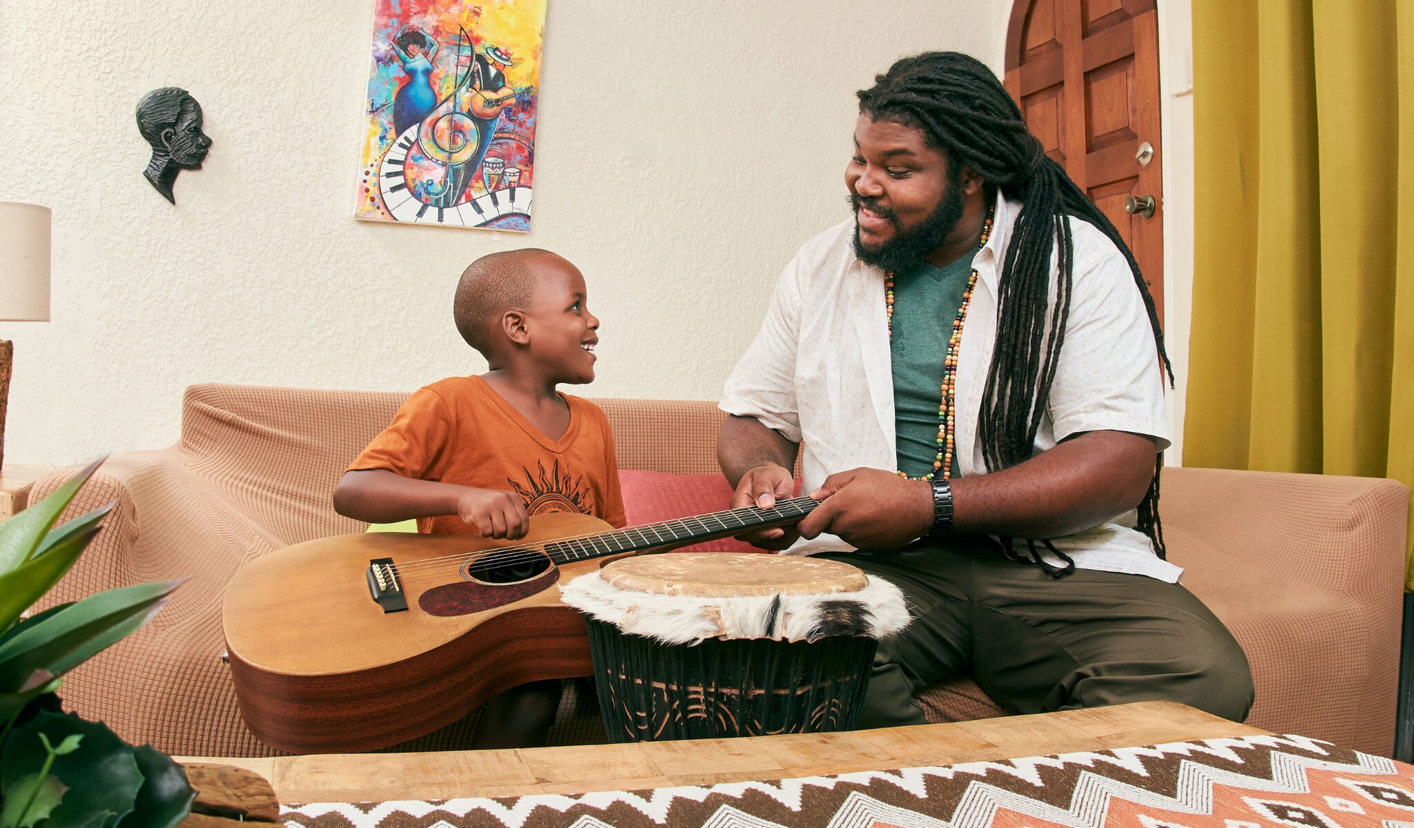 african american father and son smiling